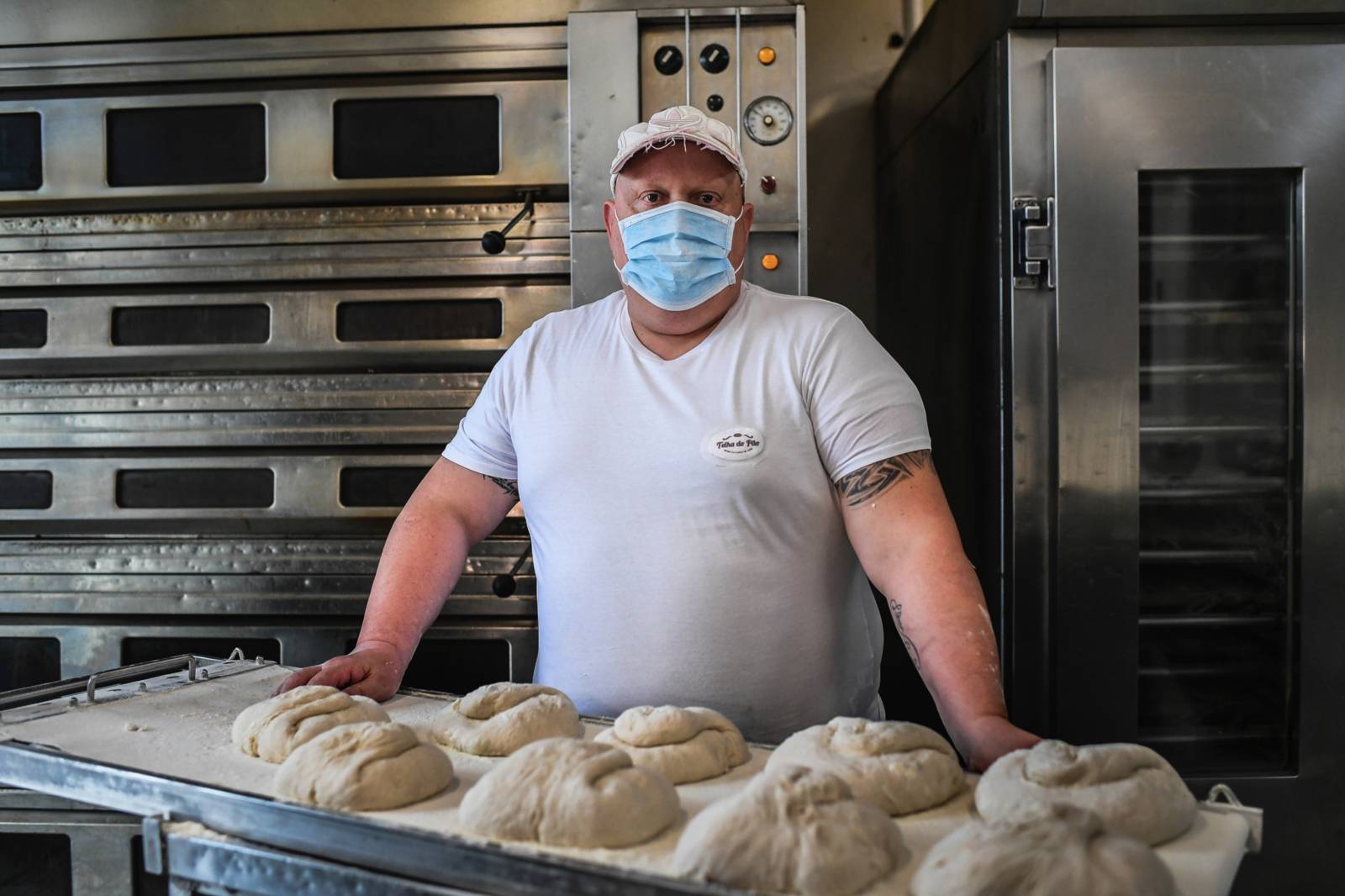 A baker wearing a face mask