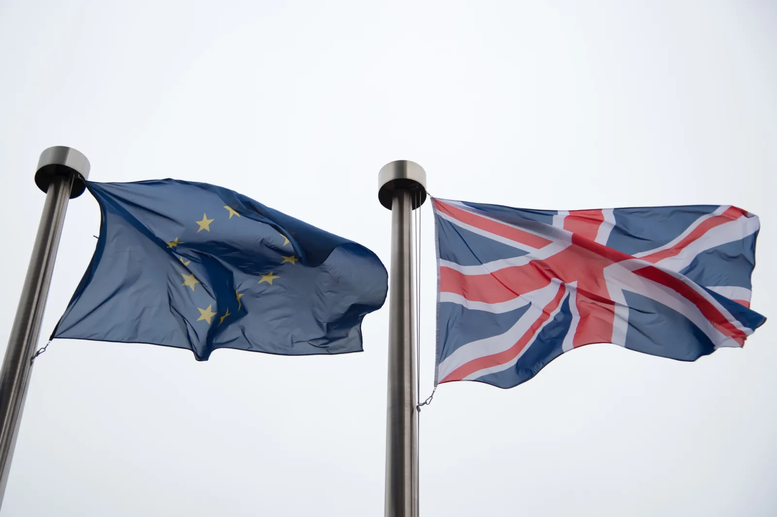 British and European flags in front of the Berlaymont building