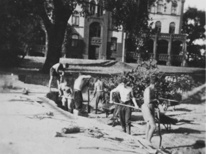 Participants in a vocational re-training course in 1933 digging for the construction of sporting grounds next to the girls’ building