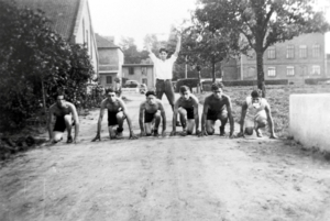Sport was of great importance: runners in 1931. Left of the path the main barn and the workshop building, to the right the school building 