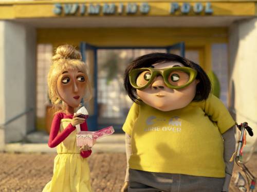 Knet-Figuren: eine dünne Frau und ein dicker Mann stehen vor einem Geschäft