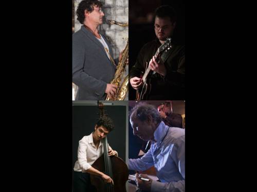 Auf dem Bild sind vier Männer an ihren Instrumenten zu sehen.