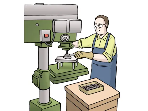 Ein Mann arbeitet an einer Maschine.