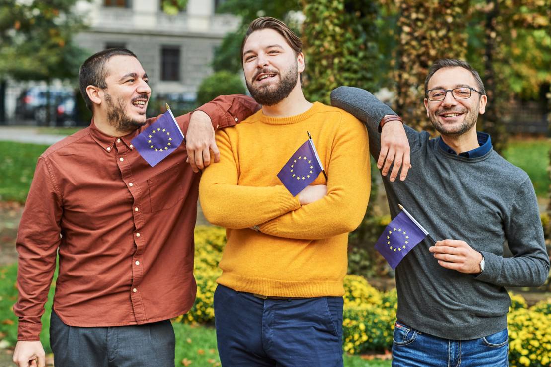 Group of young men with small EU flags Allgemeine Fotos Europa