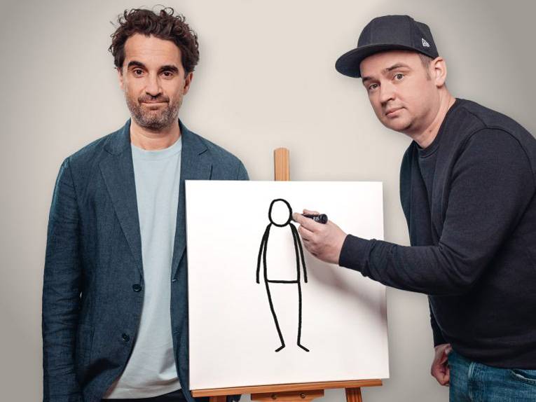 Der Schauspieler Oliver Wnuk und der Cartoonist Tobias Vogel