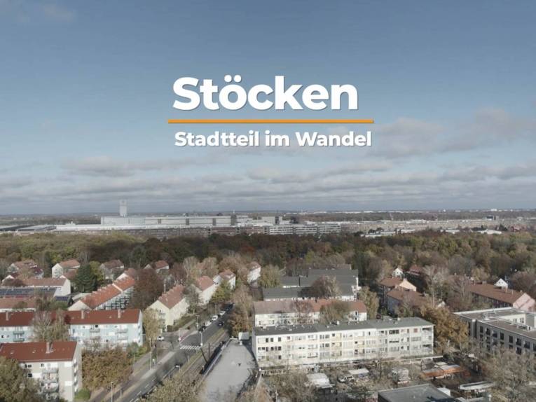 Auf dem Bild sind Gebäude des Stadtteils Stöcken zu sehen- Darüber steht "Stöcken. Stadtteil im Wandel"