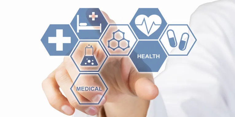 Eine Hand drückt auf visuelle Kacheln, die Icons und Begriffe der Medizin zeigen.