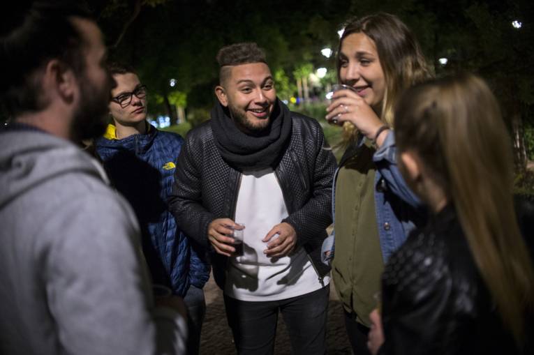 International students hanging out together during an open air party