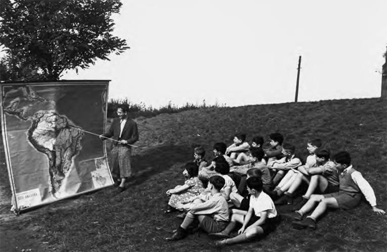 A glimpse of South America: outdoor geography lesson next to the girls’ building in 1938