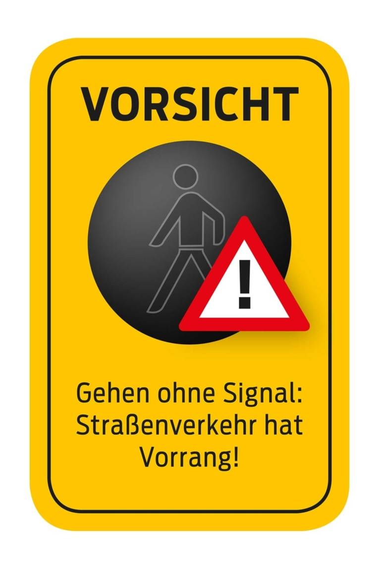Ein Piktogramm mit folgendem Text: "Vorsicht - Gehen ohne Signal: Straßenverkehr hat Vorrang!"