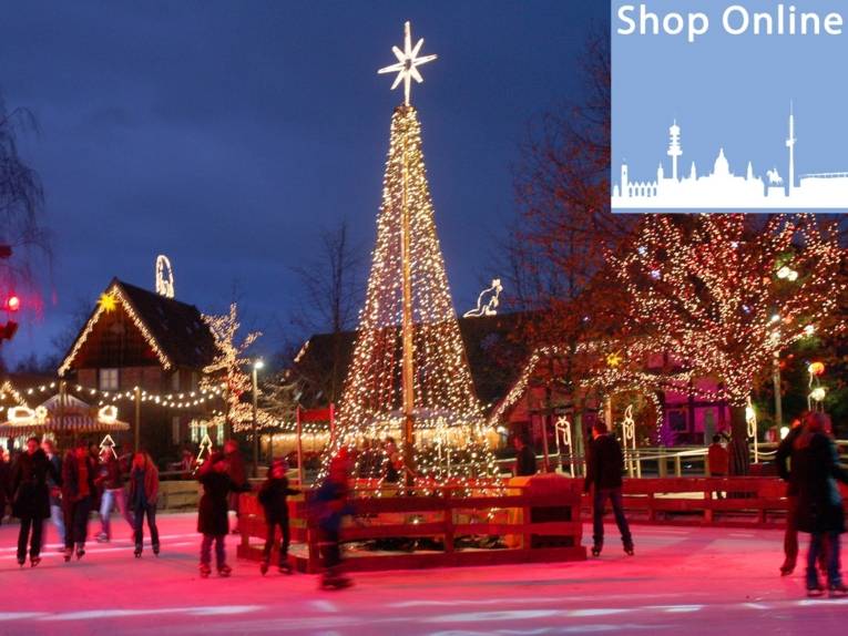 Eine bunt beleuchtete Eislaufbahn. 